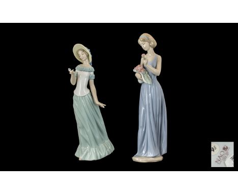 Nao by Lladro Collection of Hand Painted Porcelain Figure 'Elegant Ladies' 1. Young lady in long gown holding a butterfly hei