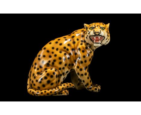 A Modern Decorative Ceramic Figure of a Crouching Leopard. Measuring 18 inches in height.