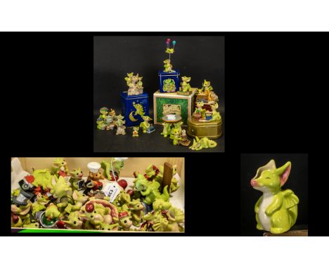 A Collection of Ceramic Ornaments comprising of figurines in boxes/tins named Cooks helper, Three though dragons from Texas, 