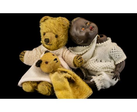 Three Mid Century Soft Toys to include a Sooty hand puppet, a teddy bear and a black baby doll in celluloid marked to neck 'R