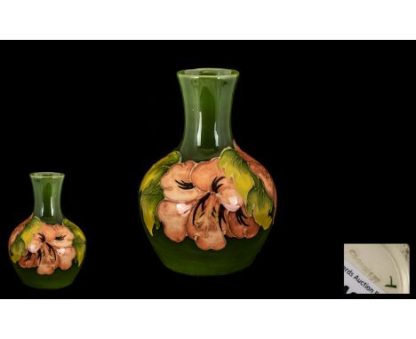 Moorcroft Small Tubelined Global Shaped Vase - 'Coral Hibiscus' design on green ground. Circa 1940's. 5 1/2" high - 12.70 cm.