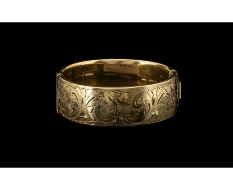 Antique Period Nice Quality 9ct Gold Bangle - with metal core. Chased decoration to one side of bangle. Marked to interior of