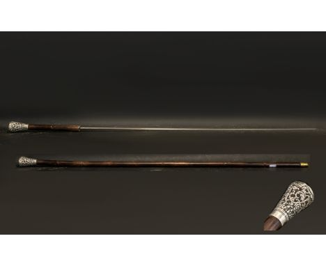 A Late 19th Century White Metal Topped Bamboo Sword Stick.  Overall length 91 cm. Please confirm with photograph.