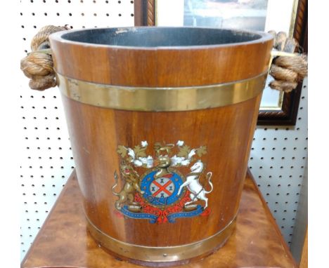 A wooden Fire bucket. Vintage or older. Decorated with a coat of arms. 