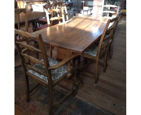 An oak Refectory-style table by Webber of Croydon, including 6 dining ladder-back chairs of which two are carvers. Webber Fur