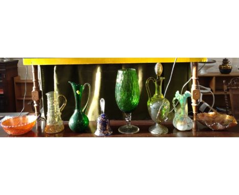 Two Carnival glass bowls 19.5cm and 23cm diameter, a light blue satin glass ewer 23cm, three jugs, a green goblet 36cm, and a