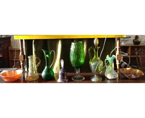 Two Carnival glass bowls 19.5cm and 23cm diameter, a light blue satin glass ewer 23cm, three jugs, a green goblet 36cm, and a