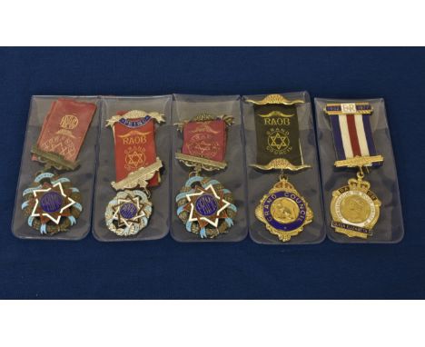 Five enamel silver and silver gilt Guernsey related Masonic jewels four relating to Sarnia Lodge 3003, three of which present