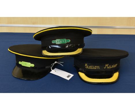 Two British Railways peaked caps one with enamelled Guards badge and the other a Ticket Collector badge; together with a peak