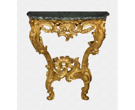 A profusely carved Rococo style giltwood and marble console table in the Louis XV taste, probably first half 20th century, th