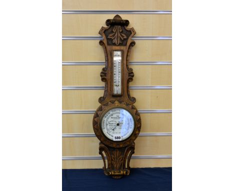 A carved wooded banjo barometer' The Universal Barometer '.  