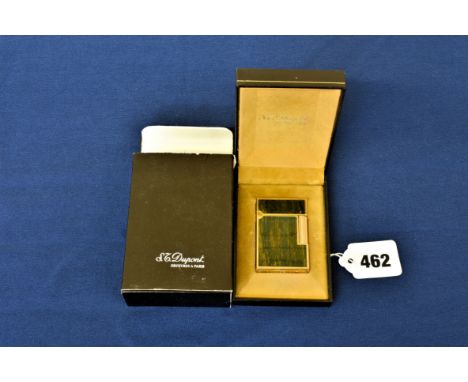 A vintage boxed S.T. Dupont lighter gold plated with wood effect decoration.  