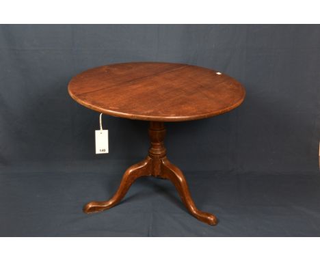 A George III oak tilt top tripod table (reduced in height) 