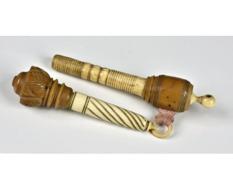 Two 19th century turned bone and Coquilla nut needle cases one having an integrated tape measure, the other with lotus flower