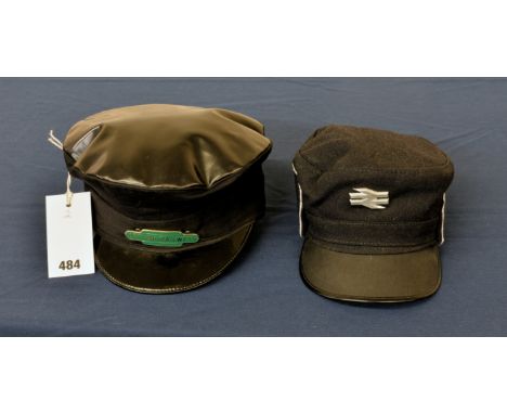 A British Railways train driver's 'greasetop' cap with green enamel badge, size 7 together with a later style BR driver's cap