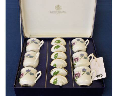 A boxed Royal Worcester "POT DE CREME" set in the Astley pattern, comprising six cups with lids. (mint)  