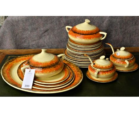 Clarice Cliff dinner ware decorated in the orange Aura pattern, c. 1934, with Bizarre and Wilkinson pottery backstamps, compr