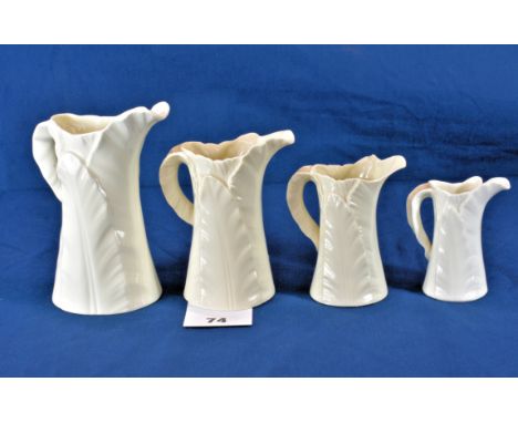 A graduated set of four Royal Worcester blanc de chine moulded leaf pattern jugs 5 7/8 - 3½in.  