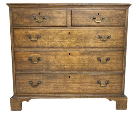 Early 20th century Georgian design oak chest, fitted with two short over three long drawers, lower moulded edge over bracket 