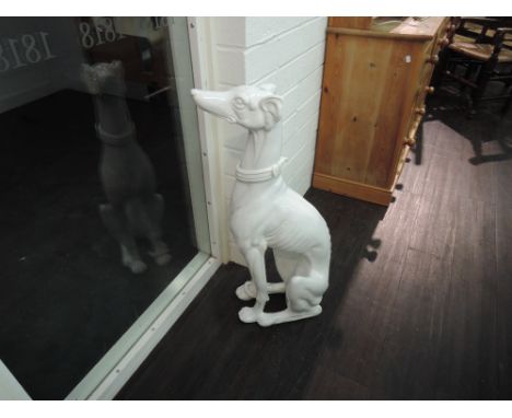 A white ceramic life size greyhound