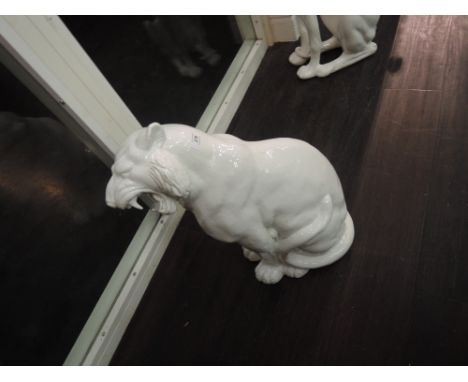 A white ceramic sabre tooth tiger or similar big cat