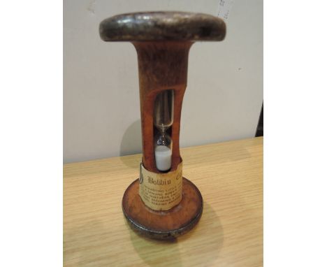 A vintage treen egg timer, modelled as a bobbin (of sewing interest)