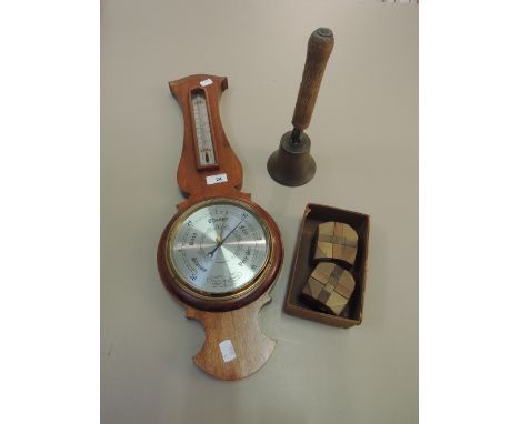 A modern barometer, vintage bell and mind tester puzzles 