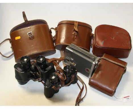 Two pairs of leather cased binoculars, together with a Bell &amp; Howell 16mm magazine camera, and an Agia Record Camera