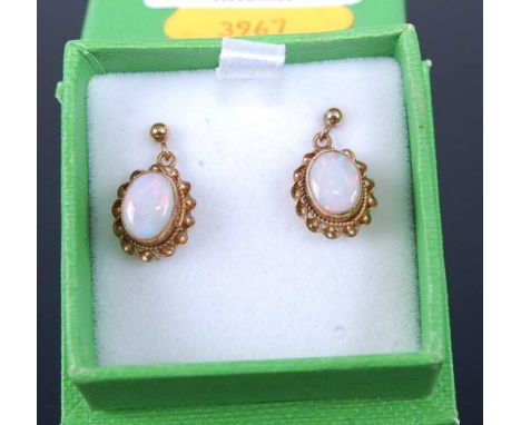 A pair of 9ct gold and cabochon opal set ear pendants, h.15mmCondition report: In good condition, no apparent faults.