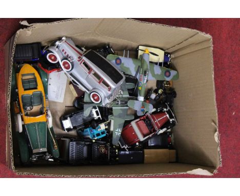 A box containing a collection of various diecast model vehicles to include Bburago