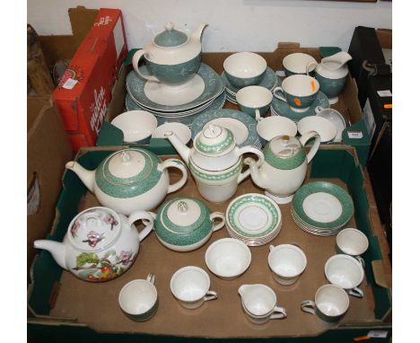 Two boxes containing a Royal Doulton Cascade pattern tea service, a Meakin Florida Sol pattern part coffee service, and a Por