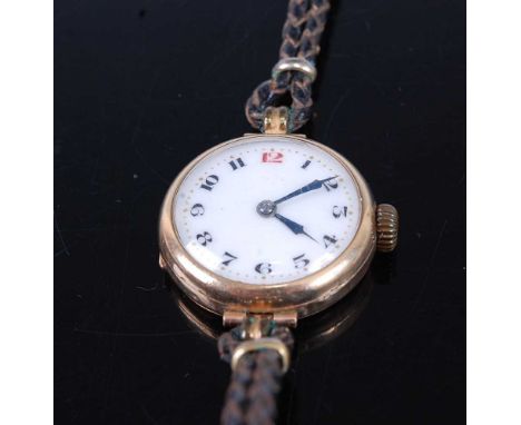 A vintage lady's 9ct gold cased mechanical wristwatch, having unsigned white enamel Arabic dial, case dia.26mm, on black leat