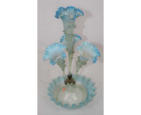 A Victorian blue tinted glass table epergne, height 44cmCondition report: Small loss to raised decoration towards base of ste