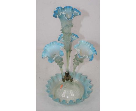 A Victorian blue tinted glass table epergne, height 44cmCondition report: Small loss to raised decoration towards base of ste