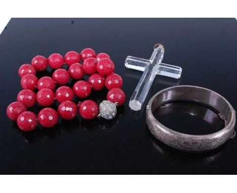 A Victorian style silver and engraved hinge bangle, together with a cut crystal cross pendant of good size, height 10cm, and 