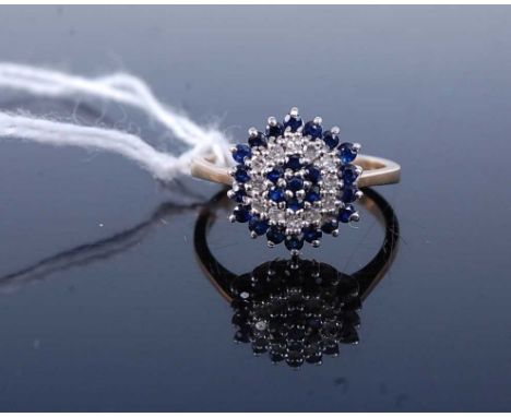 A modern 9ct gold, sapphire and diamond cluster ring, 2.7g, size K/L