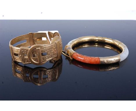 A gilt metal belt bangle with hinged action, together with a hard stone and gilt metal mounted hinge bangle (2)