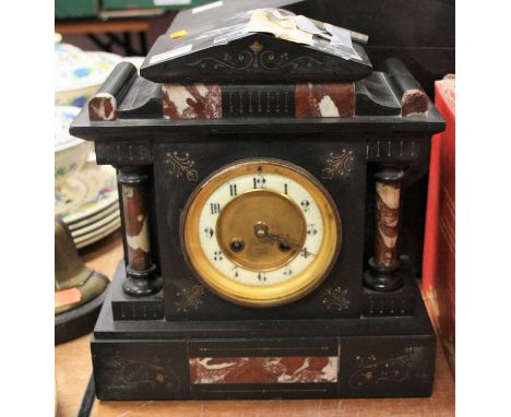 A Victorian black slate and rouge marble mantel clock, of architectural form, the enamel dial showing Arabic numerals, height