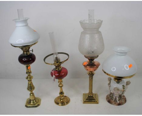 Please not that the porcelain lamp is also missing its shade - A 19th century brass and copper oil lamp in the form of a Cori