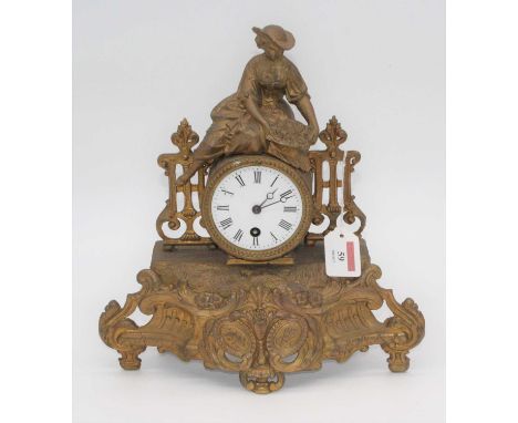 A 19th century French gilt painted metal figural mantel clock, the enamel dial showing Roman numerals, height 32cm