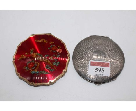 A George VI lady's silver powder compact, having engine turned decoration and monogrammed cartouche; together with a lady's S