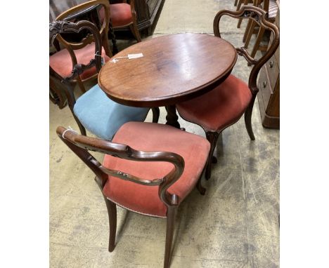 A Victorian oval tripod table, width 68cm, depth 52cm, height 72cm together with four Victorian spoon back dining chairs (thr