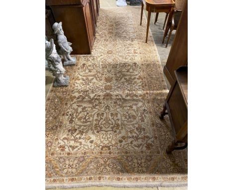 An Agra ivory ground carpet, 440 x 180cm