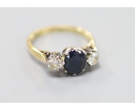 A sapphire and diamond three-stone ring, 18ct gold and platinum setting, size K, gross 3.3 grams.