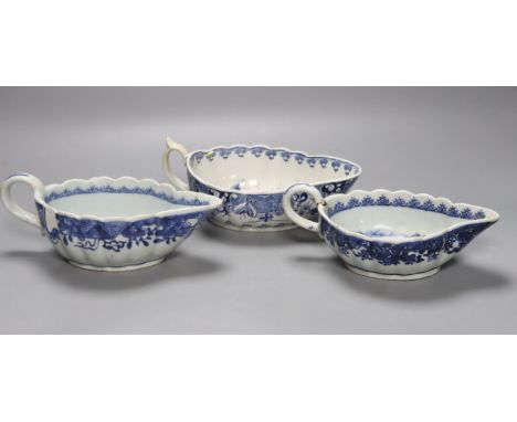 A Worcester Doughnut pattern blue and white sauceboat circa 1775 and two Chinese blue and white sauceboats, Qianlong period, 