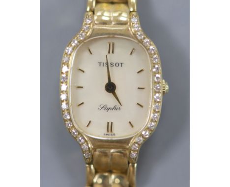 A lady's modern 9ct gold and diamond set Tissot Saphir quartz? wrist watch, 18.5cm,gross 26.2 grams.