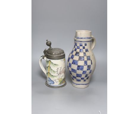 An 18th/19th century German faience pewter-mounted stein decorated with a stag and a German stoneware pitcher, height 25cm &a
