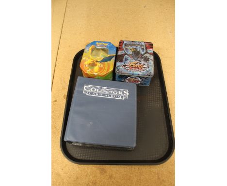 A selection of 2007/8/9 Pokemon cards in a tin together with a tin of 1996 JDS's Yu-Gi-Uh cards and a collectors album of 199