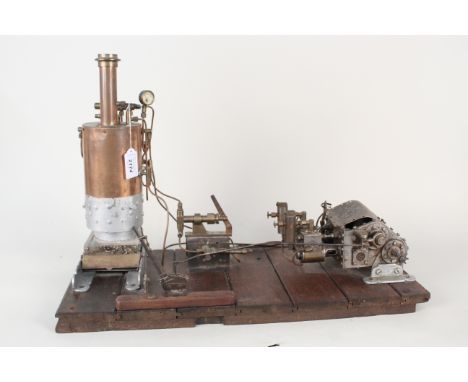 An early 20th Century hand built twin cylinder horizontal steam engine with vertical fire tube boiler and internal coil super