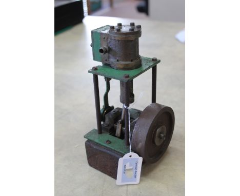 A vintage vertical four column slide valve engine